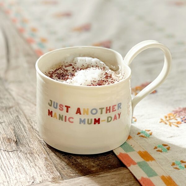 https://saos2023.s3-accelerate.amazonaws.com/wp-content/uploads/2026/09/Just-another-manic-mum-day-mug-with-cappuccino-600x600.jpg